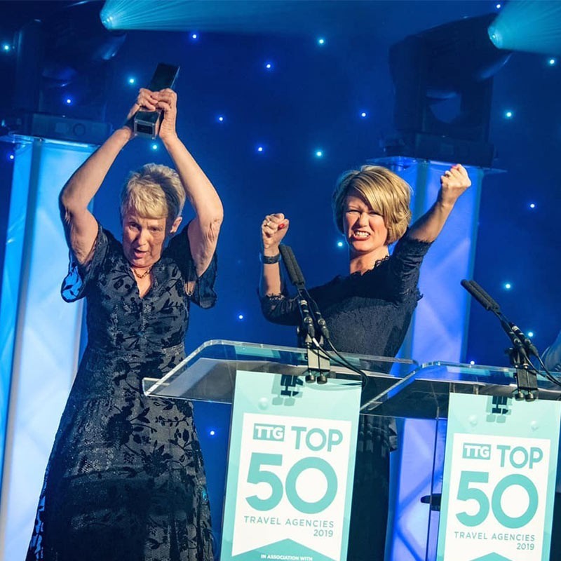 Frances and Claire receiving an award