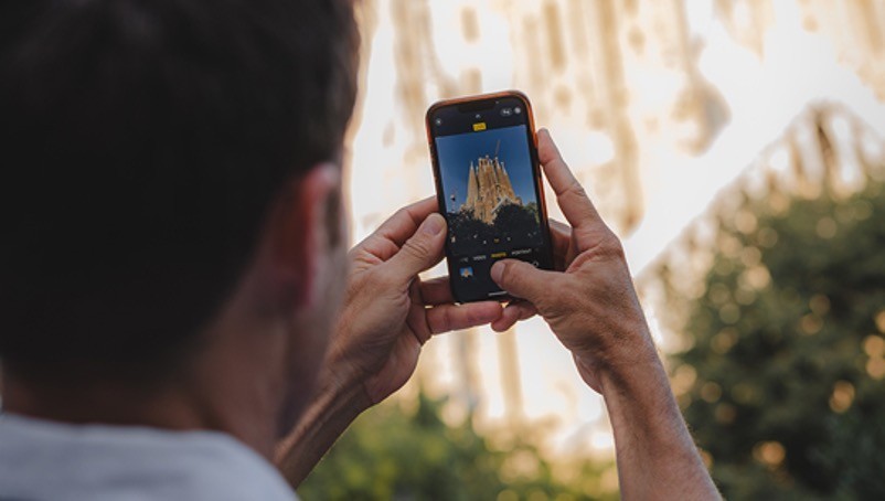 Man taking photo using his phone