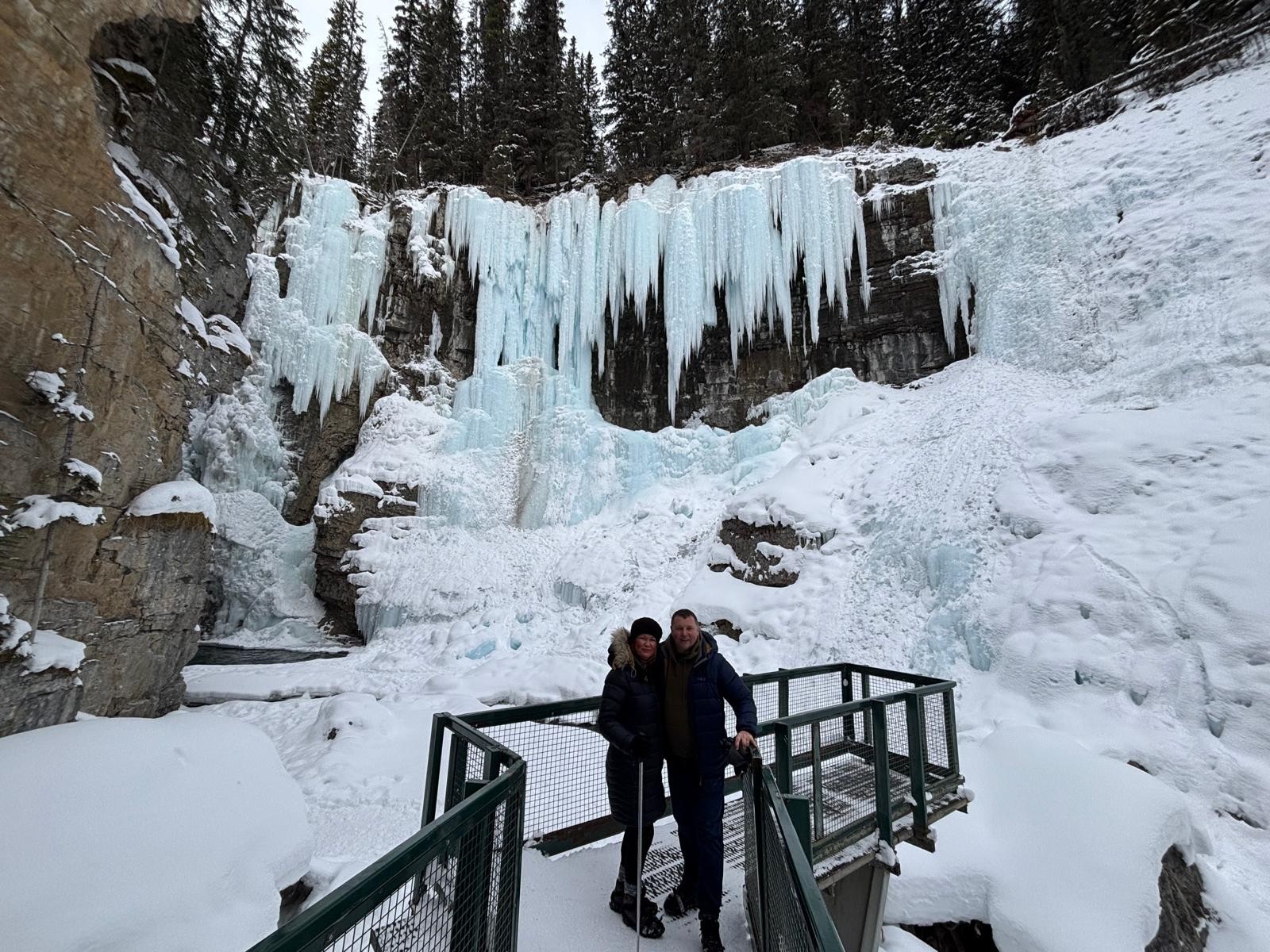 Claire and her husband in the wintry conditions