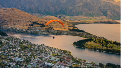 Paraglider above New Zealand town