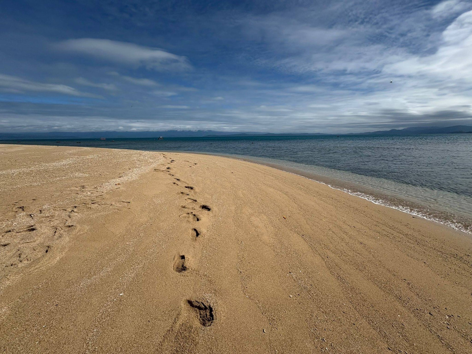 Footsteps on a sandy beach