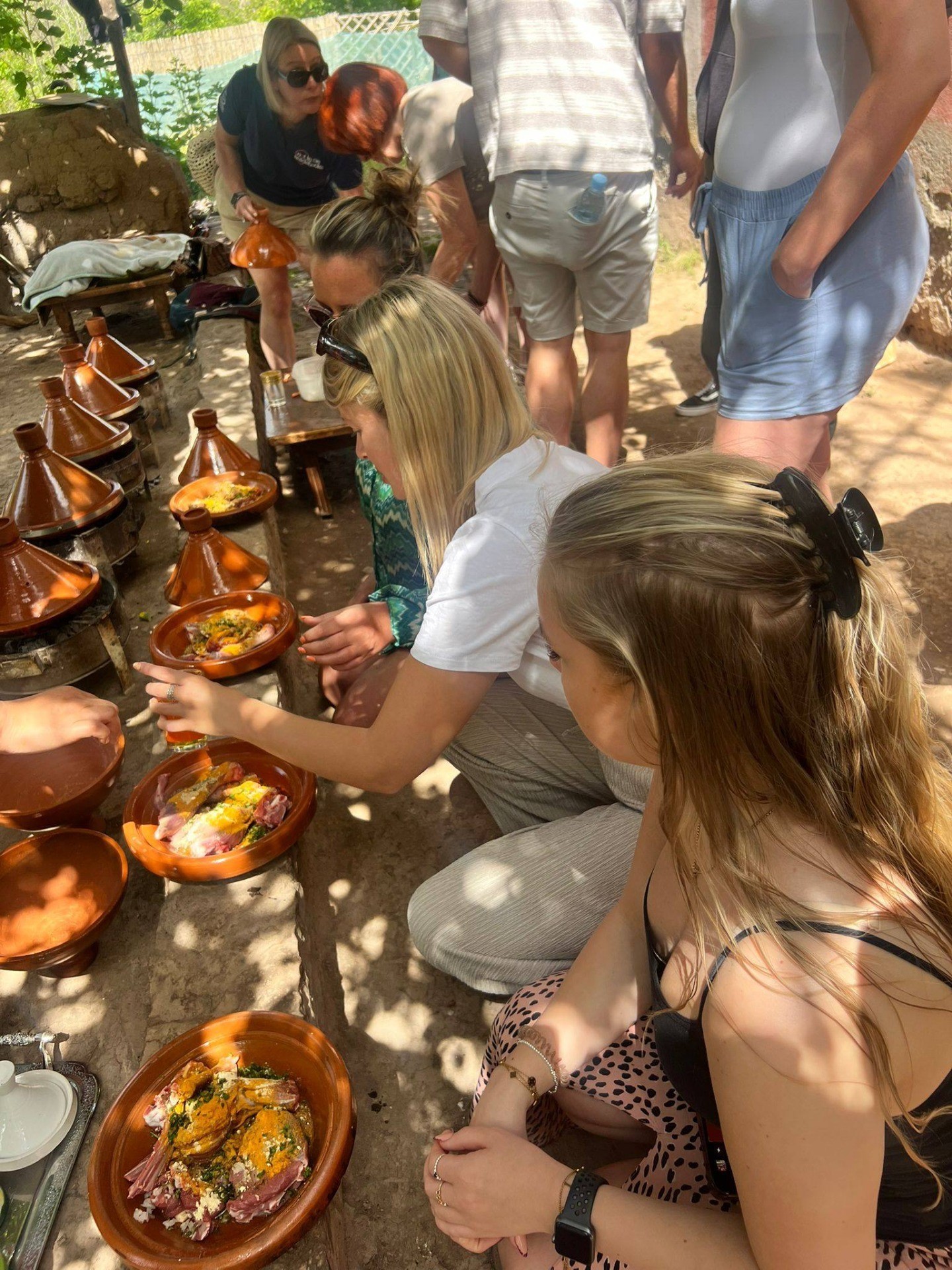 Eating Moroccan food along a wall