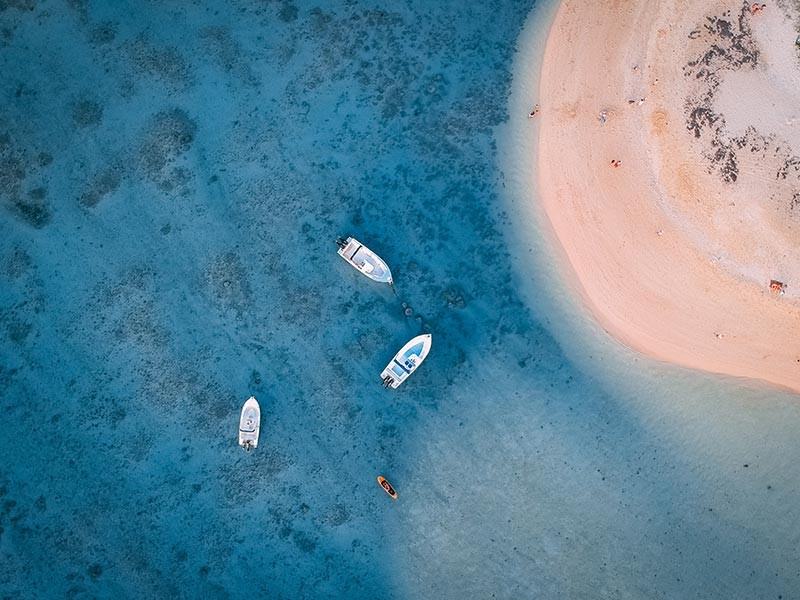 Boats at a beach in Mauritius